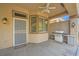Comfortable covered patio with built-in grill, privacy fencing and convenient access to the outdoors at 10800 Brinkwood Ave, Las Vegas, NV 89134