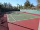 Well-maintained tennis court with great lighting for an evening match at 10800 Brinkwood Ave, Las Vegas, NV 89134