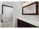 Modern bathroom featuring a walk-in shower, a stylish vanity, and sleek fixtures at 1136 Jamesbury Rd, Las Vegas, NV 89135