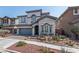Charming two-story home featuring stone accents, a two-car garage, and desert landscaping in a well-maintained neighborhood at 1136 Jamesbury Rd, Las Vegas, NV 89135