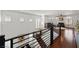 Upstairs hallway with hardwood floors, lots of natural light, and modern railings at 1136 Jamesbury Rd, Las Vegas, NV 89135