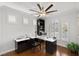 Charming home office space with ample natural light and custom built-in shelving at 1136 Jamesbury Rd, Las Vegas, NV 89135