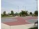 Well-maintained basketball court, featuring multiple hoops and a covered picnic area at 1162 Red Margin Ct # 101, Las Vegas, NV 89183