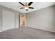 Spacious bedroom with closet, ceiling fan, and adjacent bathroom at 1162 Red Margin Ct # 101, Las Vegas, NV 89183