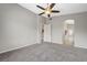 Spacious bedroom with neutral tones, plush carpeting, and a ceiling fan at 1162 Red Margin Ct # 101, Las Vegas, NV 89183