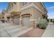 Charming townhome with attached garage, stone accents, and well-maintained landscaping at 1162 Red Margin Ct # 101, Las Vegas, NV 89183