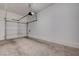 View of a two car garage with a cement floor and a white garage door at 1162 Red Margin Ct # 101, Las Vegas, NV 89183