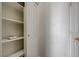 Hallway with built-in storage shelves and doors at 1162 Red Margin Ct # 101, Las Vegas, NV 89183