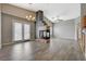 Bright living room with fireplace, wood floors, French doors, and vaulted ceilings at 1162 Red Margin Ct # 101, Las Vegas, NV 89183