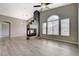 Bright and airy living room with modern fireplace, hardwood floors, and vaulted ceilings at 1162 Red Margin Ct # 101, Las Vegas, NV 89183
