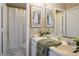 Bright bathroom with double sinks, a large mirror, and modern fixtures at 1163 Regal Lily Way, Las Vegas, NV 89123