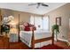 Cozy bedroom with a four-poster bed, warm lighting, and elegant decor at 1163 Regal Lily Way, Las Vegas, NV 89123