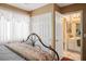 Bedroom with neutral color scheme, and adjacent bathroom at 1163 Regal Lily Way, Las Vegas, NV 89123