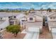 Charming two-story home with a well-manicured front yard and driveway at 1163 Regal Lily Way, Las Vegas, NV 89123