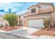 Beautiful two-story home featuring a well-kept yard and a convenient two-car garage at 1163 Regal Lily Way, Las Vegas, NV 89123