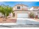 Charming two-story home with a well-maintained front yard and a two-car garage at 1163 Regal Lily Way, Las Vegas, NV 89123