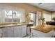 A bright kitchen with stainless steel appliances, granite countertops, and a central island providing ample workspace at 1163 Regal Lily Way, Las Vegas, NV 89123