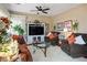 Cozy living room with comfortable seating, a TV, and lots of natural light creating an inviting space at 1163 Regal Lily Way, Las Vegas, NV 89123
