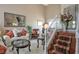 Staircase view of the formal living room with lots of seating at 1163 Regal Lily Way, Las Vegas, NV 89123
