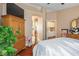 Relaxing bedroom featuring wood floors and an ensuite at 1163 Regal Lily Way, Las Vegas, NV 89123