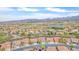 Expansive aerial shot showcasing residential community with scenic views of distant mountains and green spaces at 1304 Autumn Wind Way, Henderson, NV 89052