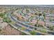 A beautiful aerial view showcases the neighborhood with mature trees and well-maintained streets at 1304 Autumn Wind Way, Henderson, NV 89052