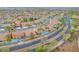 An aerial view showcases the neighborhood with mature trees and well-maintained streets at 1304 Autumn Wind Way, Henderson, NV 89052