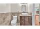 Bathroom featuring tiled walls, granite countertop, and modern fixtures at 1304 Autumn Wind Way, Henderson, NV 89052