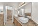 Elegant bathroom with double sinks, granite countertops, and tiled shower at 1304 Autumn Wind Way, Henderson, NV 89052