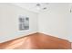 Inviting bedroom with hardwood floors, window, and ceiling fan at 1304 Autumn Wind Way, Henderson, NV 89052