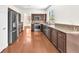 Bright kitchen showcasing stainless steel appliances, granite countertops, and wood floors at 1304 Autumn Wind Way, Henderson, NV 89052