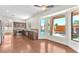 Open kitchen and view of backyard pool, stainless appliances and hardwood floors at 1304 Autumn Wind Way, Henderson, NV 89052