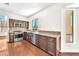 Spacious kitchen featuring stainless steel appliances, granite countertops, and a garden window at 1304 Autumn Wind Way, Henderson, NV 89052