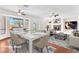 Open floor plan living and dining area with a fireplace and backyard access at 1304 Autumn Wind Way, Henderson, NV 89052
