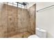 Modern shower with glass door, tile surround, and dual shower heads at 1304 Autumn Wind Way, Henderson, NV 89052
