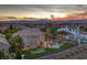 A stunning backyard with a pool, water feature, and a putting green creating a luxurious outdoor retreat at 1377 Ruby Sky Ct, Henderson, NV 89052
