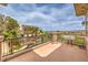 Scenic balcony overlooking a private pool, palm trees, and distant mountains on a beautiful day at 1377 Ruby Sky Ct, Henderson, NV 89052
