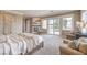 Bedroom featuring a modern fireplace, sliding glass doors, seating, and neutral color palette at 1377 Ruby Sky Ct, Henderson, NV 89052