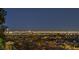 A breathtaking city view with vibrant lights creates a mesmerizing backdrop for the surrounding landscape at 1377 Ruby Sky Ct, Henderson, NV 89052