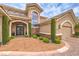 Stunning two-story home featuring a grand entrance, meticulous landscaping, and a convenient circular driveway at 1377 Ruby Sky Ct, Henderson, NV 89052