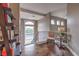 Upstairs landing with hardwood floors, views to the outside, decorative seating, and custom bookshelves at 1377 Ruby Sky Ct, Henderson, NV 89052