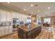 Gourmet kitchen featuring a large island, stainless steel appliances, and custom cabinetry at 1377 Ruby Sky Ct, Henderson, NV 89052