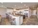 Expansive kitchen featuring an oversized island, granite countertops, and stainless steel appliances at 1377 Ruby Sky Ct, Henderson, NV 89052