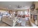 Open-concept living room with fireplace and seamless access to the kitchen and dining areas at 1377 Ruby Sky Ct, Henderson, NV 89052