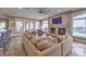Bright and airy living room with fireplace, large windows, and comfortable seating at 1377 Ruby Sky Ct, Henderson, NV 89052