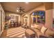 Relaxing outdoor space with comfortable seating area, ceiling fan, and backyard view at 1377 Ruby Sky Ct, Henderson, NV 89052