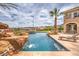 Resort-style pool with rock waterfall, landscaping, privacy and an amazing view at 1377 Ruby Sky Ct, Henderson, NV 89052