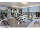 Well-equipped fitness center featuring weights, benches, and cardio machines, all with expansive city views at 150 Las Vegas Blvd # 1004, Las Vegas, NV 89101