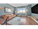 Comfortable living room featuring hardwood floors, a city view, and a sleek television setup at 150 Las Vegas Blvd # 1004, Las Vegas, NV 89101