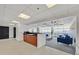 Open concept lounge area with modern kitchenette and comfortable seating, offering stunning city views at 150 Las Vegas Blvd # 1004, Las Vegas, NV 89101
